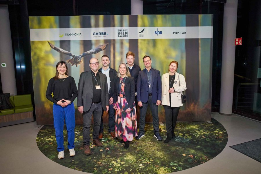 Jury 2026 und Wettbewerbsleitung (v. l. n. r.): Sylvi Hoschke, Thomas Weidenbach, Heiko Rödel, Claudia Sewig, Arnd Greve, Ivo Bozic, Dagny Lüdemann